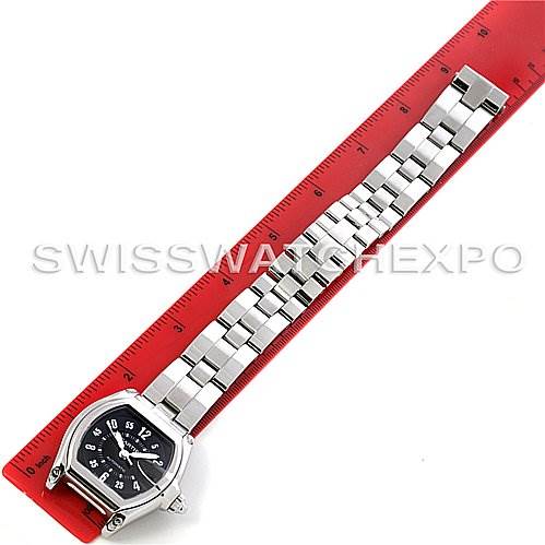 The image shows a full view of a Cartier Roadster W62004V3 Men's Stainless Steel Black Dial W62004V3 Men's Stainless Steel Black Dial watch placed alongside a red ruler for measurement.