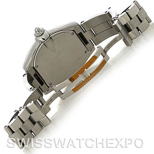 The image shows the back view of a Cartier Roadster W62032X6 Men's Stainless Steel Silver Dial W62032X6 Men's Stainless Steel Silver Dial watch, focusing on the stainless steel case, crown, and open bracelet clasp.