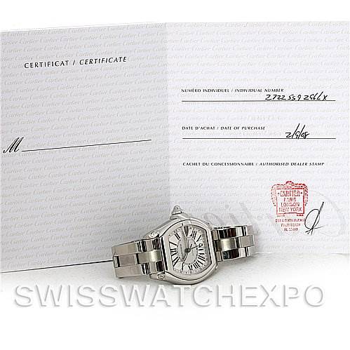 The Cartier Roadster W62032X6 Men's Stainless Steel Silver Dial W62032X6 Men's Stainless Steel Silver Dial watch is shown at an angle, accompanied by its certificate of authenticity.