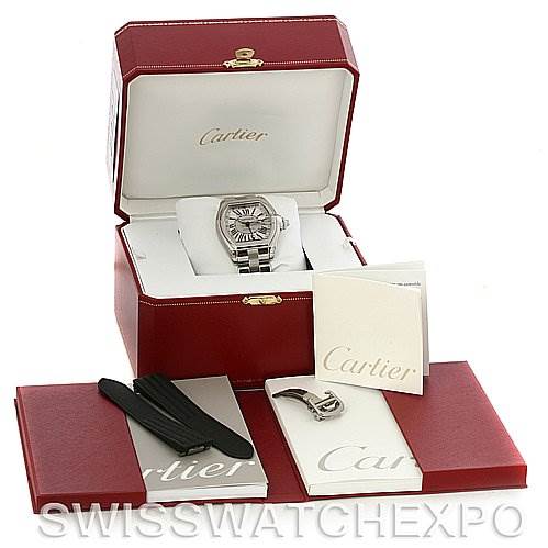 The Cartier Roadster W62032X6 Men's Stainless Steel Silver Dial W62032X6 Men's Stainless Steel Silver Dial watch is shown in its box, alongside additional straps, a clasp, and documentation.