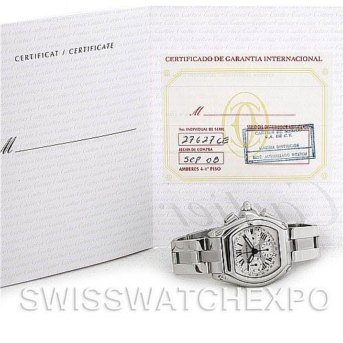 The image shows a Cartier Roadster W62019X6 Men's Stainless Steel Silver Dial W62019X6 Men's Stainless Steel Silver Dial watch along with its international warranty certificate and documentation.
