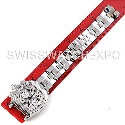 The image shows a top-down view of a Cartier Roadster W62019X6 Men's Stainless Steel Silver Dial W62019X6 Men's Stainless Steel Silver Dial watch with its entire bracelet stretched alongside a ruler.