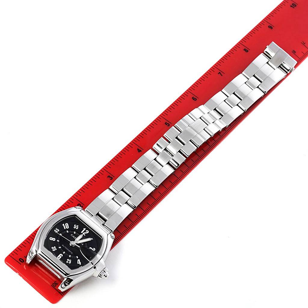 The Cartier Roadster W62004V3 Men's Stainless Steel Black Dial W62004V3 Men's Stainless Steel Black Dial watch is shown from the top view, displaying its face and entire stainless steel bracelet against a ruler.