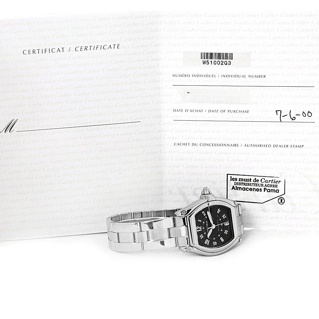 The image shows a Cartier Roadster W62004V3 Men's Stainless Steel Black Dial W62004V3 Men's Stainless Steel Black Dial watch laying flat with its certificate and purchase information in the background.