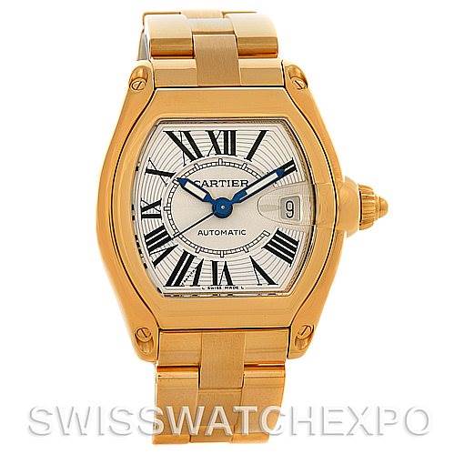 The image shows a frontal view of a Cartier Roadster W62005V1 Men
s Yellow Gold Silver Dial W62005V1 Men
s Yellow Gold Silver Dial watch, detailing its gold case, bracelet, and Roman numeral dial.
