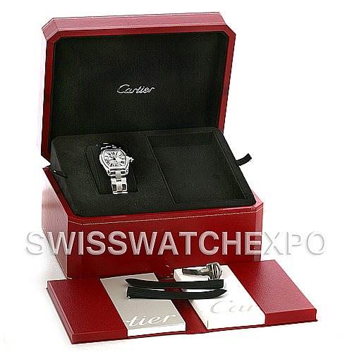 The image shows a Cartier Roadster W62025V3 Men's Stainless Steel Silver Dial W62025V3 Men's Stainless Steel Silver Dial watch at an angle inside its red Cartier box with additional straps and a card.