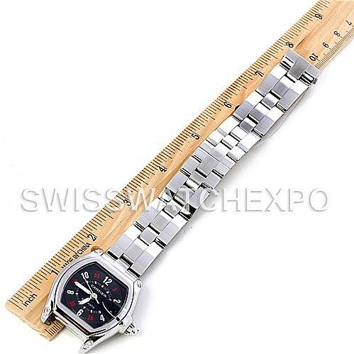 The Cartier Roadster W62002V3 Men's Stainless Steel Black Dial W62002V3 Men's Stainless Steel Black Dial watch is shown from an overhead angle, displaying its face, case, and full metal bracelet alongside a ruler for scale.