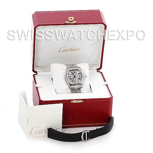 The Cartier Roadster W62032X6 Men's Stainless Steel Silver Dial W62032X6 Men's Stainless Steel Silver Dial watch is shown in its case with an extra black strap and accompanying booklet.
