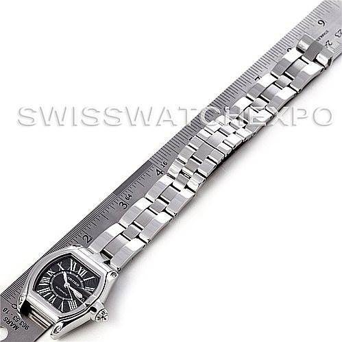 The image shows the Cartier Roadster W62041V3 Men's Stainless Steel Black Dial W62041V3 Men's Stainless Steel Black Dial watch vertically aligned next to a ruler, showcasing the face and entire bracelet.