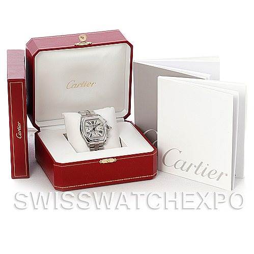 This image shows a Cartier Roadster W62019X6 Men's Stainless Steel Silver Dial W62019X6 Men's Stainless Steel Silver Dial watch in its red presentation box, accompanied by a booklet and outer packaging.