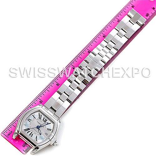 The Cartier Roadster W62025V3 Men's Stainless Steel Silver Dial W62025V3 Men's Stainless Steel Silver Dial watch is shown laid flat next to a ruler, displaying the whole face and bracelet.