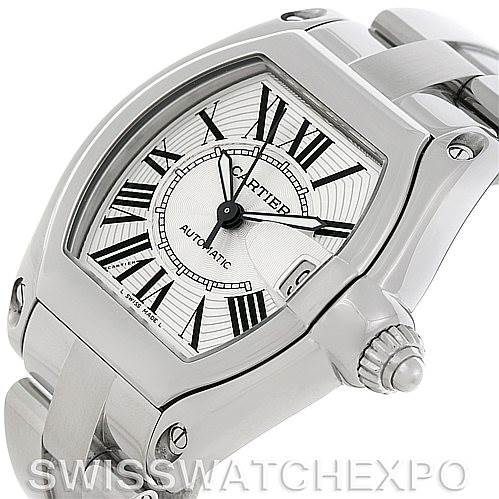 The image shows a close-up angled view of the Cartier Roadster W62025V3 Men's Stainless Steel Silver Dial W62025V3 Men's Stainless Steel Silver Dial watch, featuring its dial, crown, and part of the bracelet.
