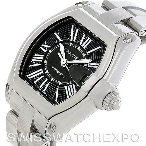 The image shows a Cartier Roadster W62041V3 Men's Stainless Steel Black Dial W62041V3 Men's Stainless Steel Black Dial watch from an angle highlighting the face, bezel, crown, and part of the bracelet.