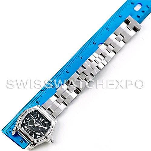 The Cartier Roadster W62041V3 Men's Stainless Steel Black Dial W62041V3 Men's Stainless Steel Black Dial watch is shown from a top view, placed next to a ruler, highlighting its face and full metal bracelet.