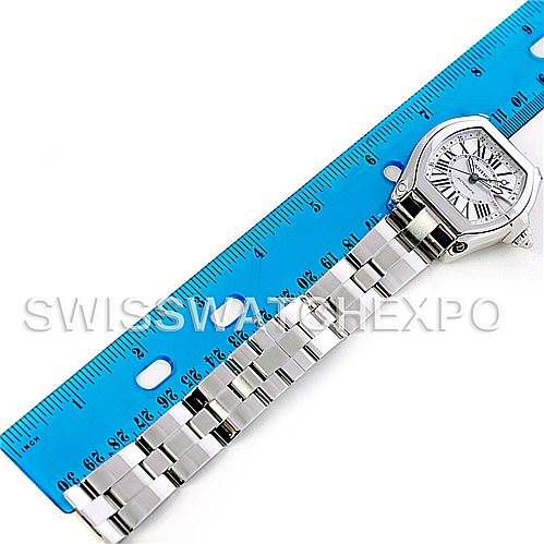 The image shows a top view of the Cartier Roadster W62032X6 Men's Stainless Steel Silver Dial W62032X6 Men's Stainless Steel Silver Dial watch placed next to a blue ruler for size reference.