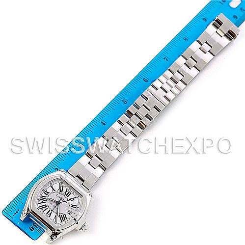 The image shows a Cartier Roadster W62032X6 Men's Stainless Steel Silver Dial W62032X6 Men's Stainless Steel Silver Dial watch photographed laid flat next to a ruler to display its full length and bracelet details.