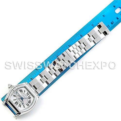 This image shows a Cartier Roadster 2510 210317CE Men's Stainless Steel Silver Dial 2510 210317CE Men's Stainless Steel Silver Dial watch displayed flat with a blue ruler beside it, showcasing the watch face and bracelet from a top-down angle.