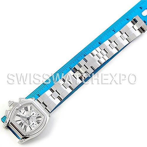 The image shows a Cartier Roadster W62019X6 Men's Stainless Steel Silver Dial W62019X6 Men's Stainless Steel Silver Dial watch laid flat next to a ruler, highlighting the bracelet and watch face.