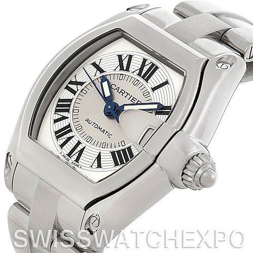 This image shows a close-up of the Cartier Roadster W62025V3 Men's Stainless Steel Silver Dial W62025V3 Men's Stainless Steel Silver Dial watch's face, crown, and part of the bracelet from an angled side view.