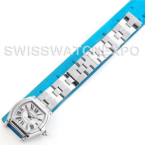 The Cartier Roadster W62025V3 Men's Stainless Steel Silver Dial W62025V3 Men's Stainless Steel Silver Dial watch is shown laid flat next to a ruler, displaying the face and full length of the metal bracelet.