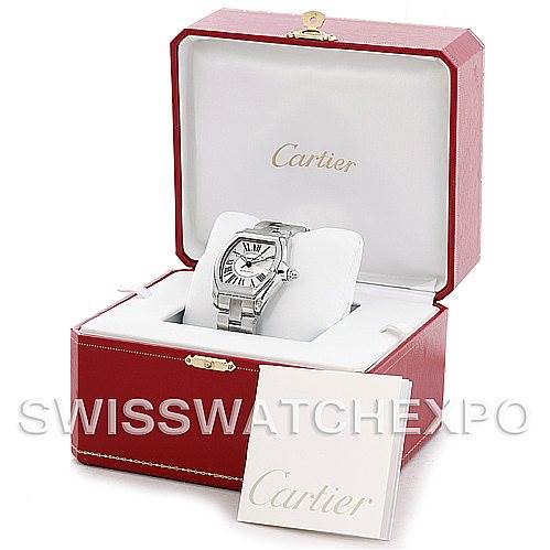 The Cartier Roadster W62025V3 Men's Stainless Steel Silver Dial W62025V3 Men's Stainless Steel Silver Dial watch is displayed in an open red box with branding, showing the entire watch and an accompanying booklet.