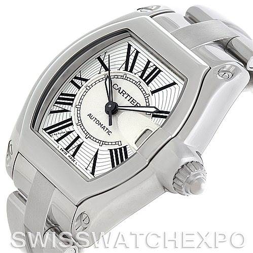 The image shows a Cartier Roadster W62025V3 Men's Stainless Steel Silver Dial W62025V3 Men's Stainless Steel Silver Dial watch from an angled side view, highlighting the dial, crown, and part of the bracelet.