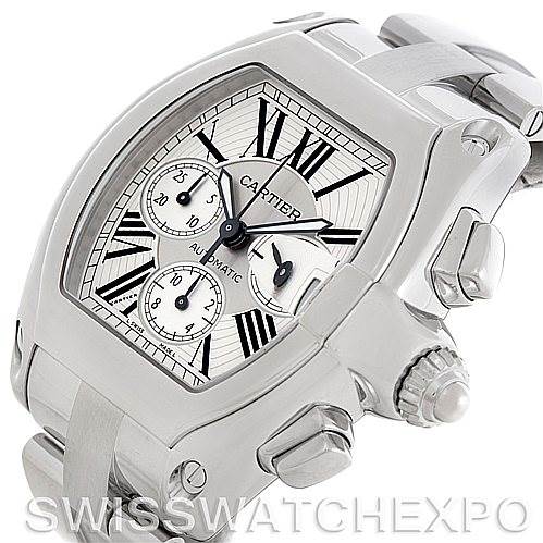 This image shows a Cartier Roadster W62019X6 Men's Stainless Steel Silver Dial W62019X6 Men's Stainless Steel Silver Dial watch from a three-quarter angle, highlighting its dial, Roman numerals, crown, pushers, and metal bracelet.