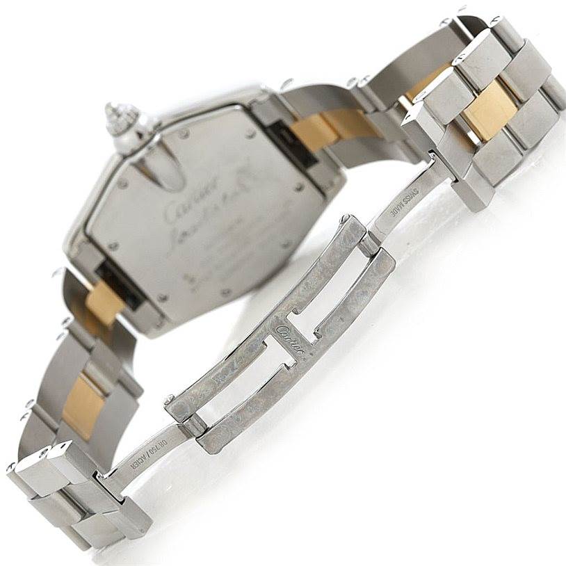 The image shows the back case and open clasp of a Cartier Roadster W62031Y4 Men's Steel and Gold (two tone) Silver Dial W62031Y4 Men's Steel and Gold (two tone) Silver Dial watch, revealing its two-tone metal bracelet.