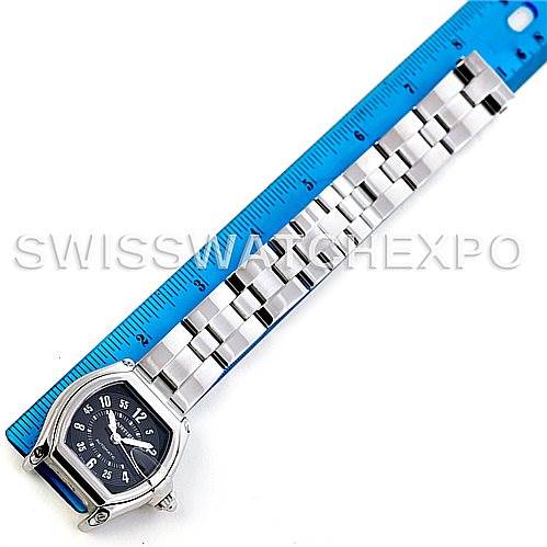 The image shows a Cartier Roadster W62004V3 Men's Stainless Steel Black Dial W62004V3 Men's Stainless Steel Black Dial watch lying flat next to a ruler, displaying the face and full length of the bracelet.