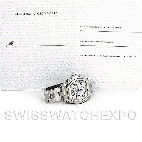 The image shows a Cartier Roadster W62019X6 Men's Stainless Steel Silver Dial W62019X6 Men's Stainless Steel Silver Dial watch from a side angle, alongside its certificate.