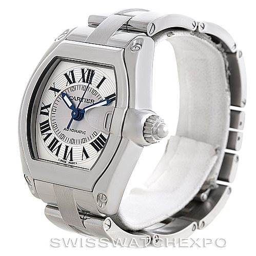 The image shows a side angle of the Cartier Roadster W62025V3 Men's Stainless Steel Silver Dial W62025V3 Men's Stainless Steel Silver Dial watch, highlighting its face, crown, case, and part of the bracelet.