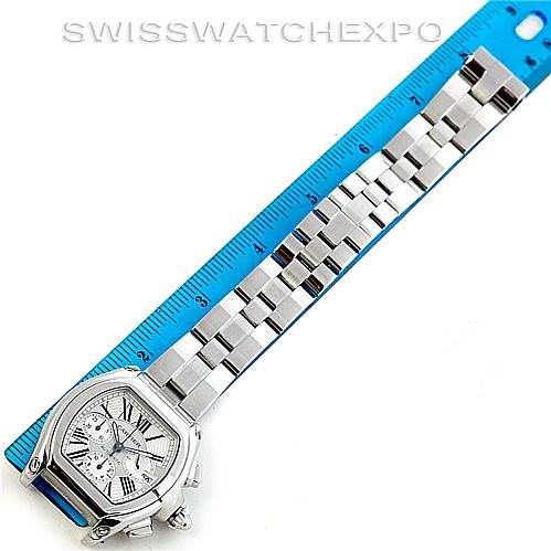The image shows a Cartier Roadster W62019X6 Men's Stainless Steel Silver Dial W62019X6 Men's Stainless Steel Silver Dial watch placed next to a ruler, highlighting its face and full bracelet.