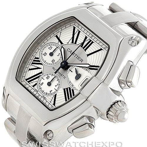 The image shows a close-up, angled view of the Cartier Roadster W62019X6 Men's Stainless Steel Silver Dial W62019X6 Men's Stainless Steel Silver Dial watch, focusing on its dial, crown, and part of the bracelet.