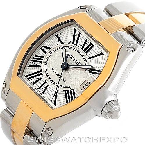 The image shows a Cartier Roadster W62031Y4 Men's Steel and Gold (two tone) Silver Dial W62031Y4 Men's Steel and Gold (two tone) Silver Dial watch, focusing on the dial, bezel, crown, and part of the bracelet at an angle.