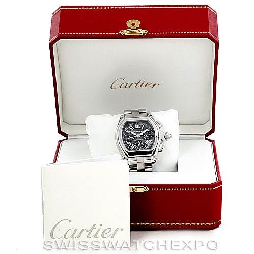 The Cartier Roadster W62007X6 Men
s Stainless Steel Black Dial W62007X6 Men
s Stainless Steel Black Dial watch is displayed front-facing in its open red case, accompanied by a booklet.