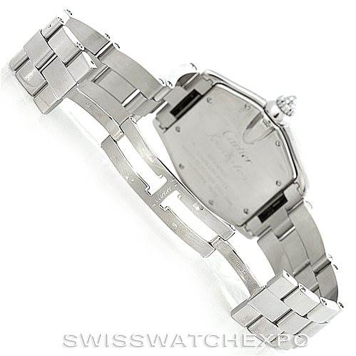 The image shows the Roadster model by Cartier from the backside, displaying the open metal bracelet and case back.