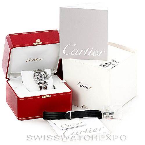 This image shows a Cartier Roadster W62032X6 Men's Stainless Steel Silver Dial W62032X6 Men's Stainless Steel Silver Dial watch at a front angle, with its box, manual, extra strap, and a branded outer box.