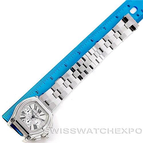 The image shows the face and full bracelet of a Cartier Roadster W62019X6 Men's Stainless Steel Silver Dial W62019X6 Men's Stainless Steel Silver Dial watch, measured against a blue ruler.