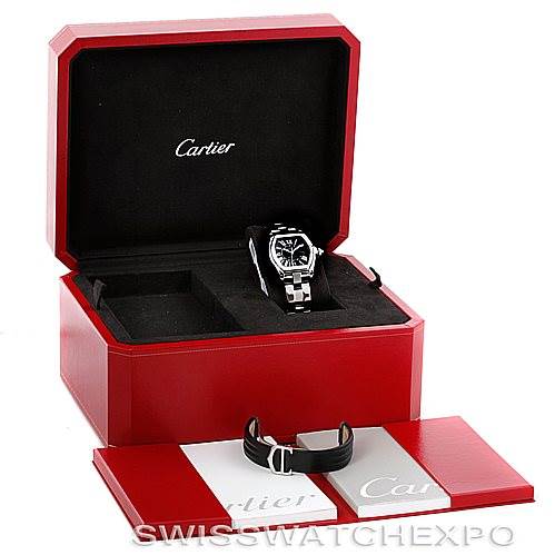 The Cartier Roadster W62041V3 Men's Stainless Steel Black Dial W62041V3 Men's Stainless Steel Black Dial watch is displayed in its open box with additional straps and accompanying manuals.