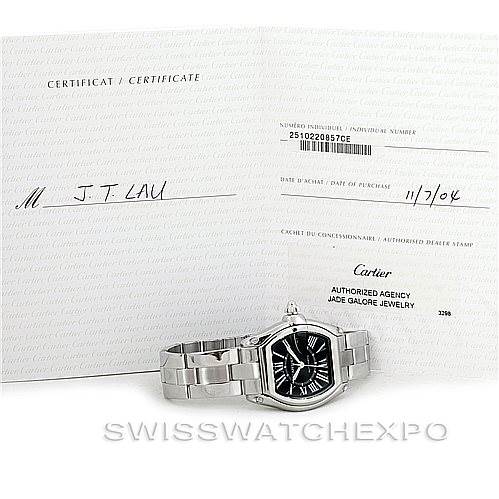 The image shows a Cartier Roadster W62041V3 Men's Stainless Steel Black Dial W62041V3 Men's Stainless Steel Black Dial watch displayed at a slight angle, alongside its certificate of authenticity.