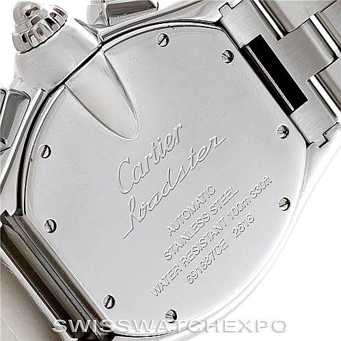 The image shows the back case of a Cartier Roadster W62019X6 Men's Stainless Steel Silver Dial W62019X6 Men's Stainless Steel Silver Dial watch, featuring the inscription with model details and part of the metal bracelet.