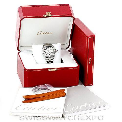 This image shows a Cartier Roadster W62025V3 Men's Stainless Steel Silver Dial W62025V3 Men's Stainless Steel Silver Dial watch in its open box, along with manuals and additional accessories.