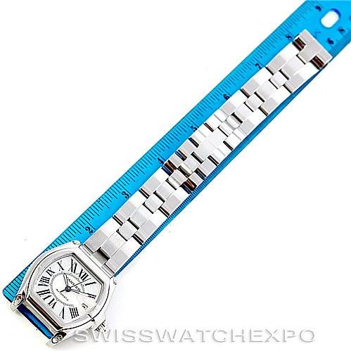 The image shows a top-down view of a Cartier Roadster W62025V3 Men's Stainless Steel Silver Dial W62025V3 Men's Stainless Steel Silver Dial watch laid next to a blue ruler.