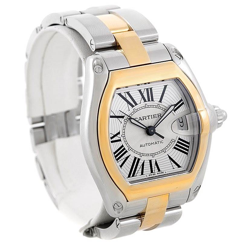 The image shows a Cartier Roadster W62031Y4 Men's Steel and Gold (two tone) Silver Dial W62031Y4 Men's Steel and Gold (two tone) Silver Dial watch at a slight angle, highlighting its face, bezel, and part of the band.