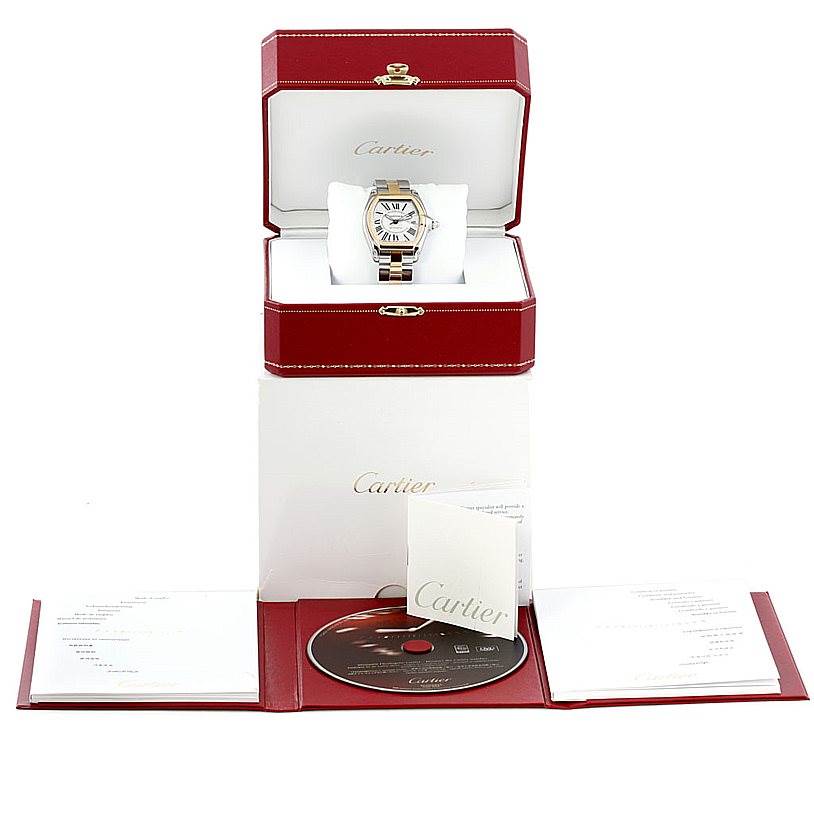 The Cartier Roadster W62031Y4 Men's Steel and Gold (two tone) Silver Dial W62031Y4 Men's Steel and Gold (two tone) Silver Dial watch is depicted front-facing in its box with accompanying documents and a CD below.