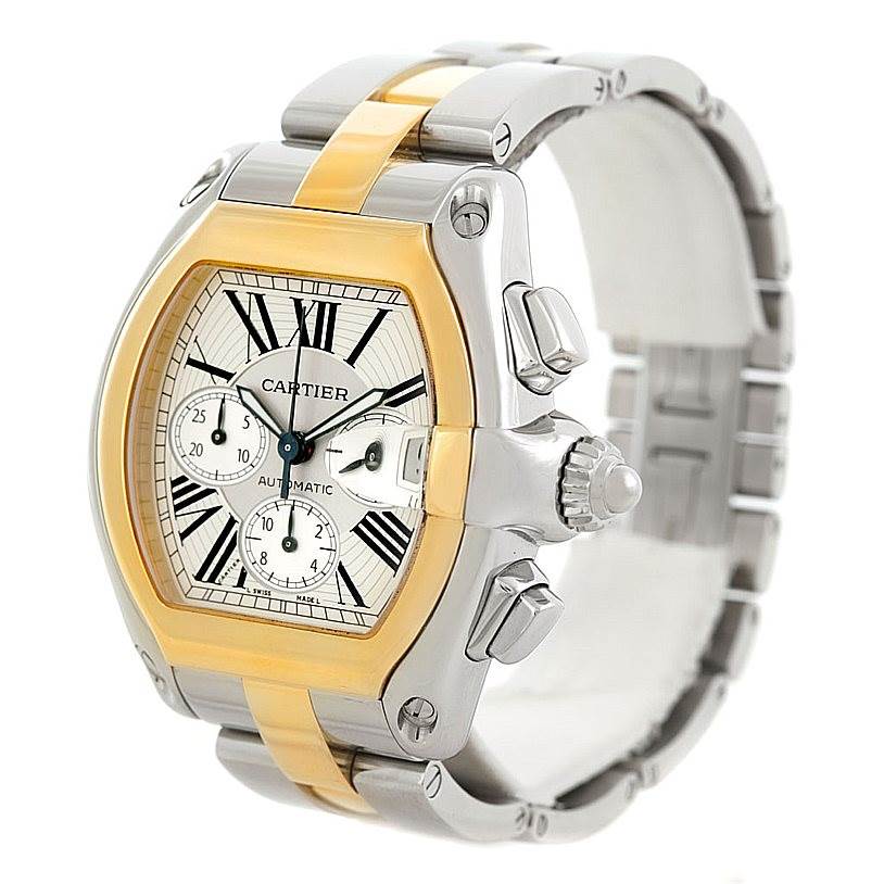 The image shows a Cartier Roadster W62027Z1 Men
s Steel and Gold (two tone) Silver Dial W62027Z1 Men
s Steel and Gold (two tone) Silver Dial watch with a gold and silver band, viewed from a three-quarters angle focusing on the dial and crown.