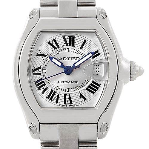 The image shows a frontal view of a Cartier Roadster W62000V3 Men's Stainless Steel Silver Dial W62000V3 Men's Stainless Steel Silver Dial watch displaying the dial, hands, crown, and part of the strap.