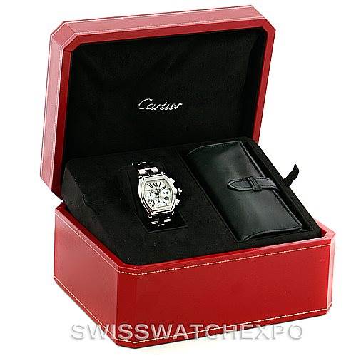 The image shows a Cartier Roadster W62019X6 Men's Stainless Steel Silver Dial W62019X6 Men's Stainless Steel Silver Dial watch and a leather watch accessory case in an open, red Cartier presentation box.
