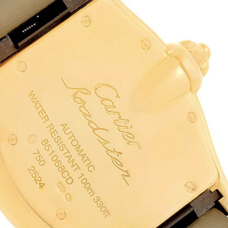 The image shows the back case of a Cartier Roadster W62005V2 Men's Yellow Gold Silver Dial W62005V2 Men's Yellow Gold Silver Dial watch, highlighting its automatic mechanism and water resistance details.