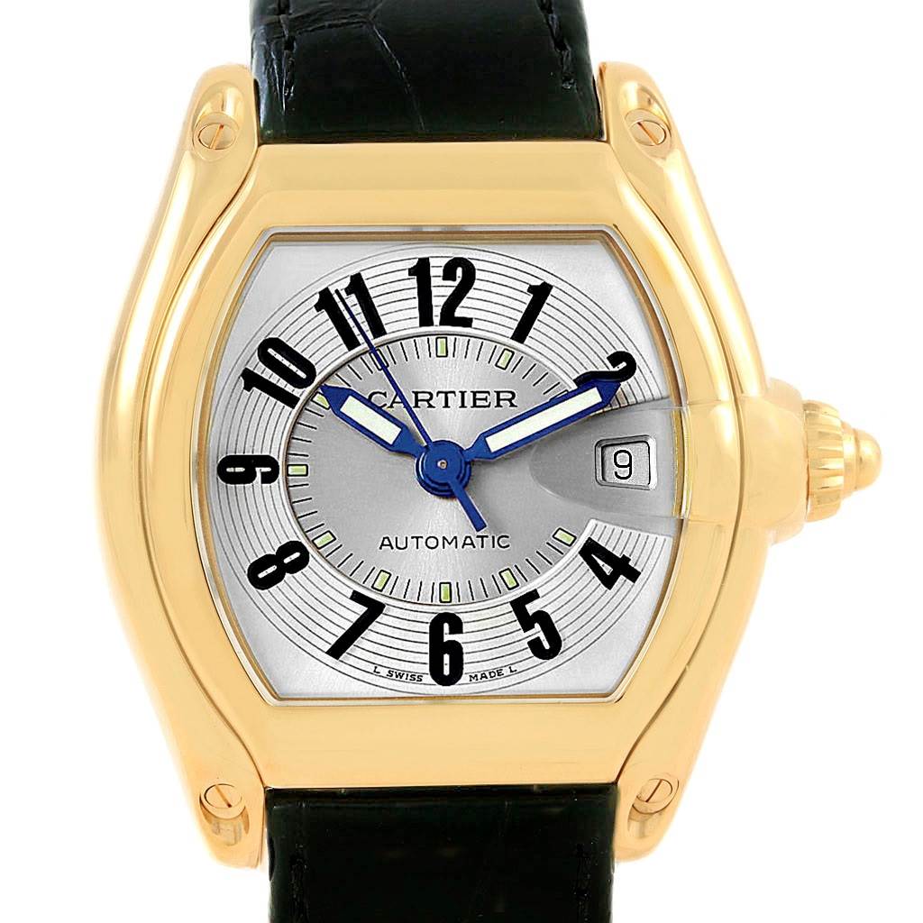 This image shows a front view of a Cartier Roadster W62005V2 Men's Yellow Gold Silver Dial W62005V2 Men's Yellow Gold Silver Dial watch highlighting its face, dial, and part of the strap.